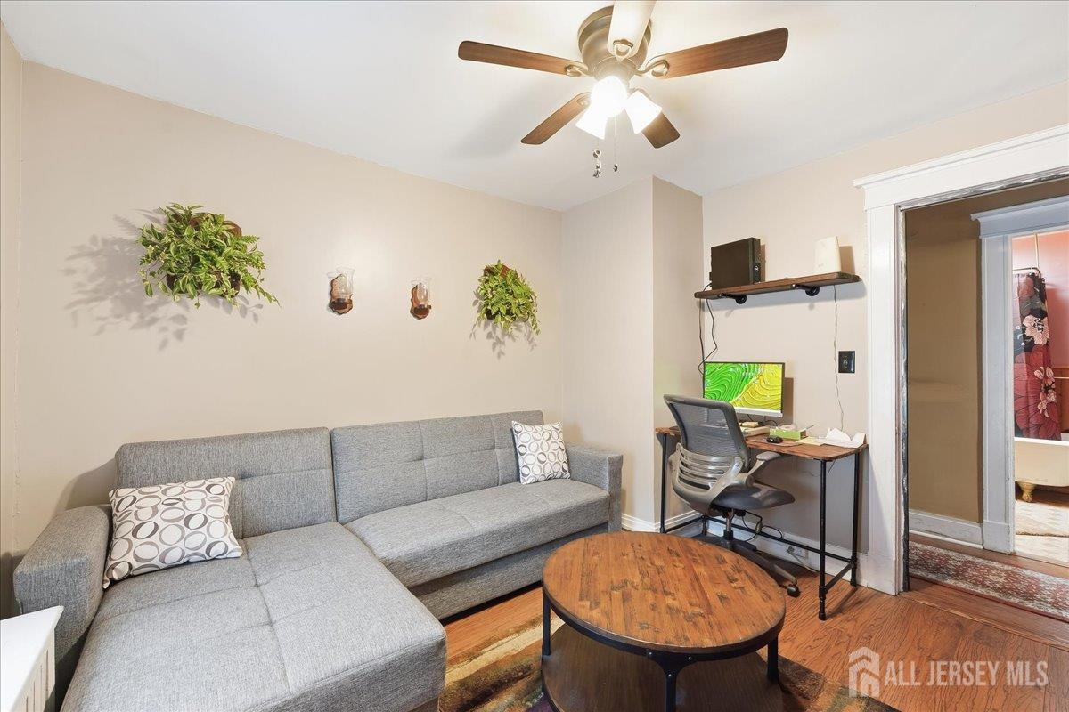 48 Bloomfield Avenue Edison, NJ 08837 - Photo 12 of 21 a living room with furniture and a rug