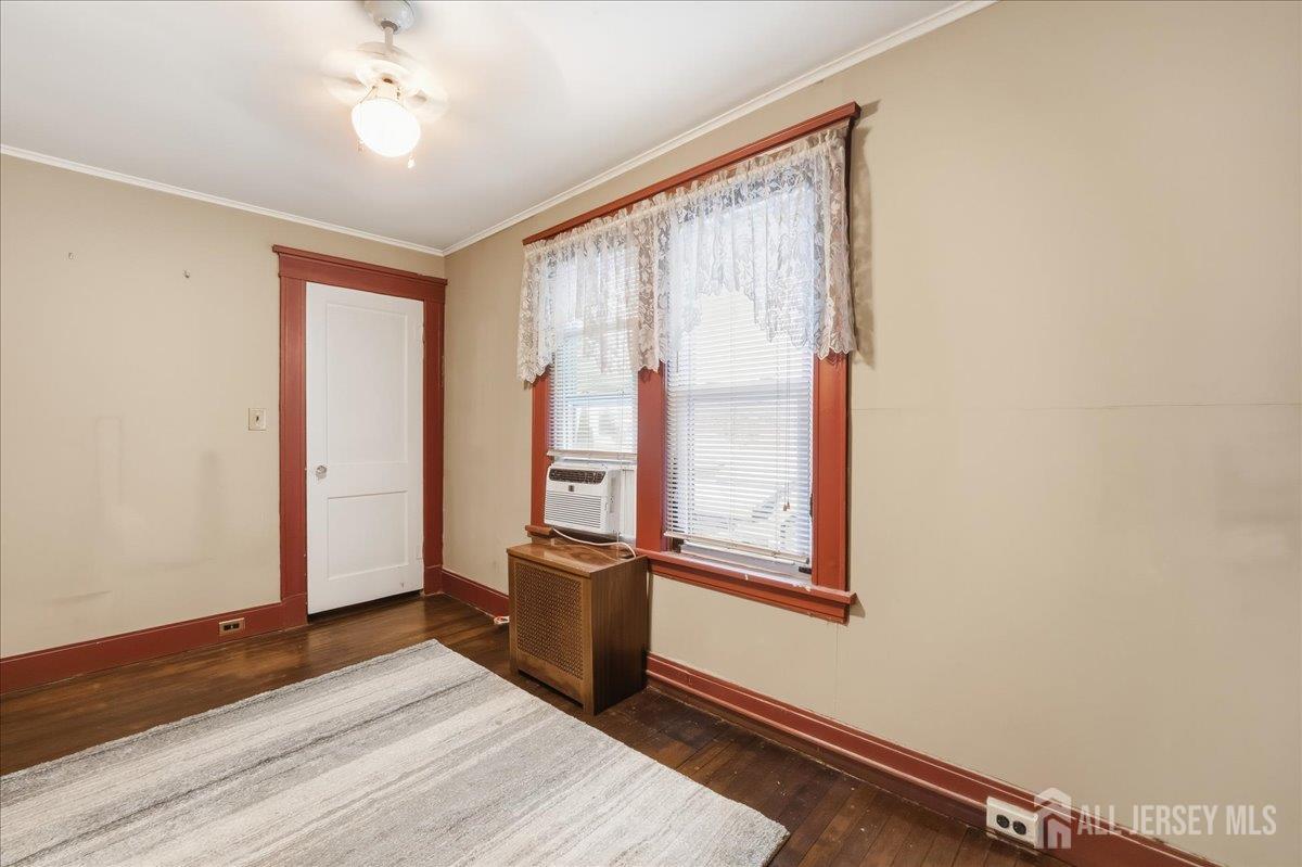 48 Bloomfield Avenue Edison, NJ 08837 - Photo 14 of 21 an empty room with wooden floor and windows