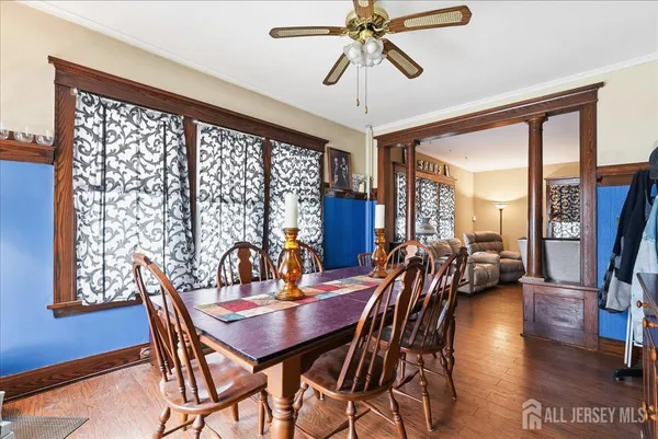 a view of a dining room with furniture window and wooden floor