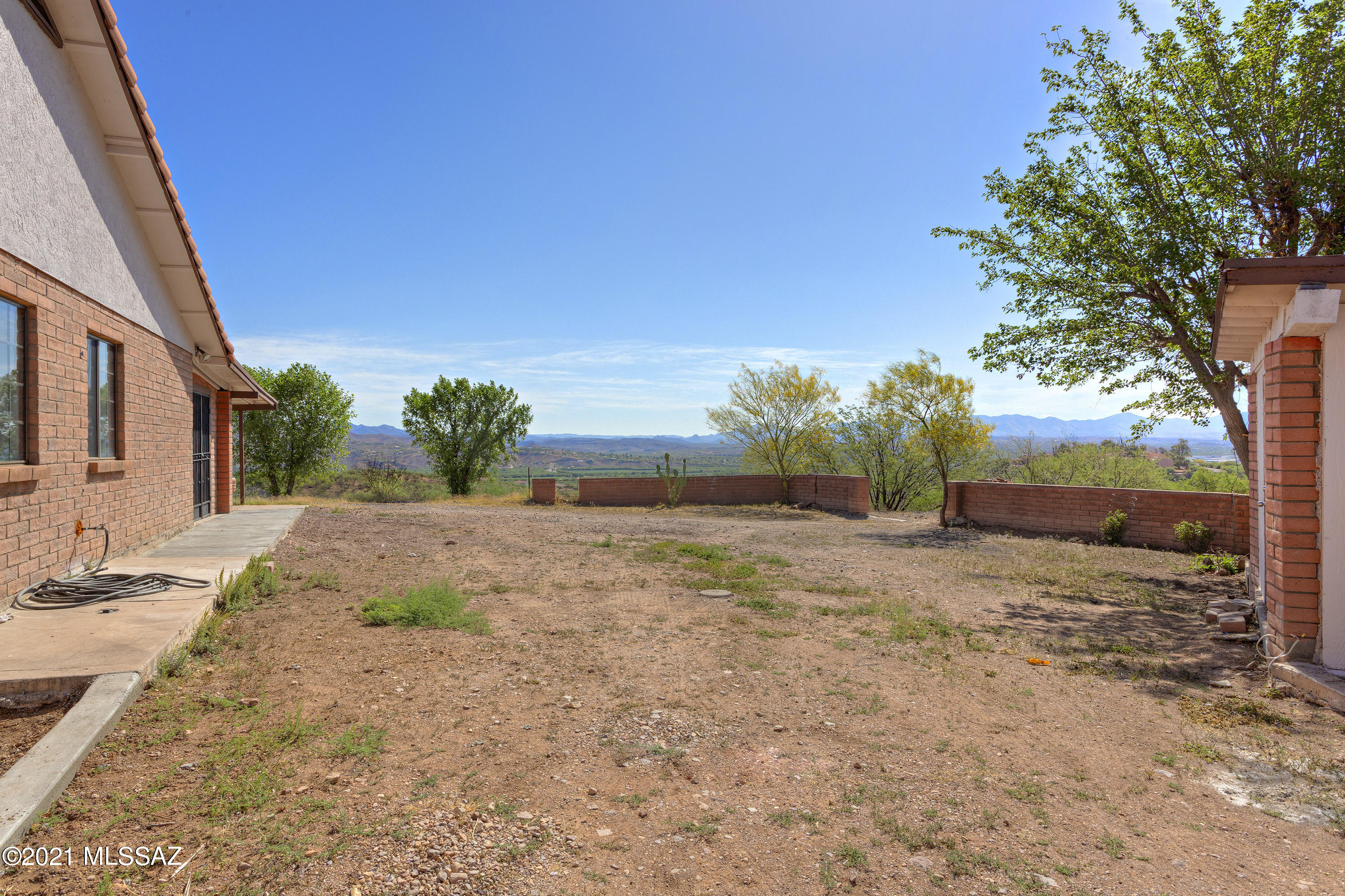 1096 Montosa Circulo Rio Rico, AZ 85648 - Photo 29 of 39 a view of a yard with plants and trees