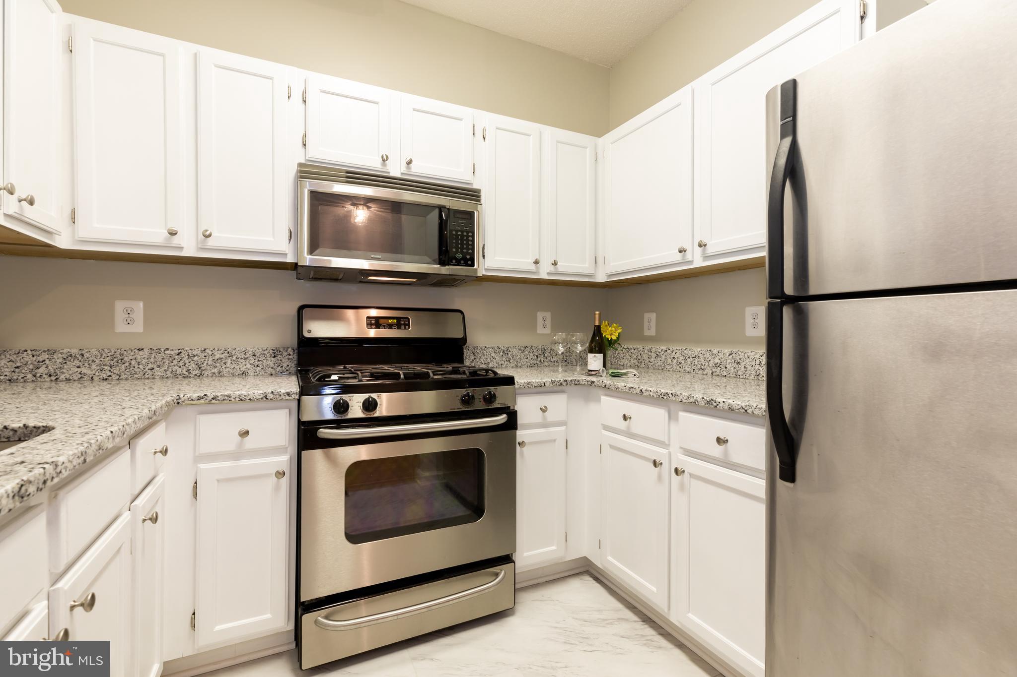12012 Taliesin Place, Unit 14 Reston, VA 20190 - Photo 1 of 30 BRIGHT WHITE CABINETS W/NEW HARDWARE!