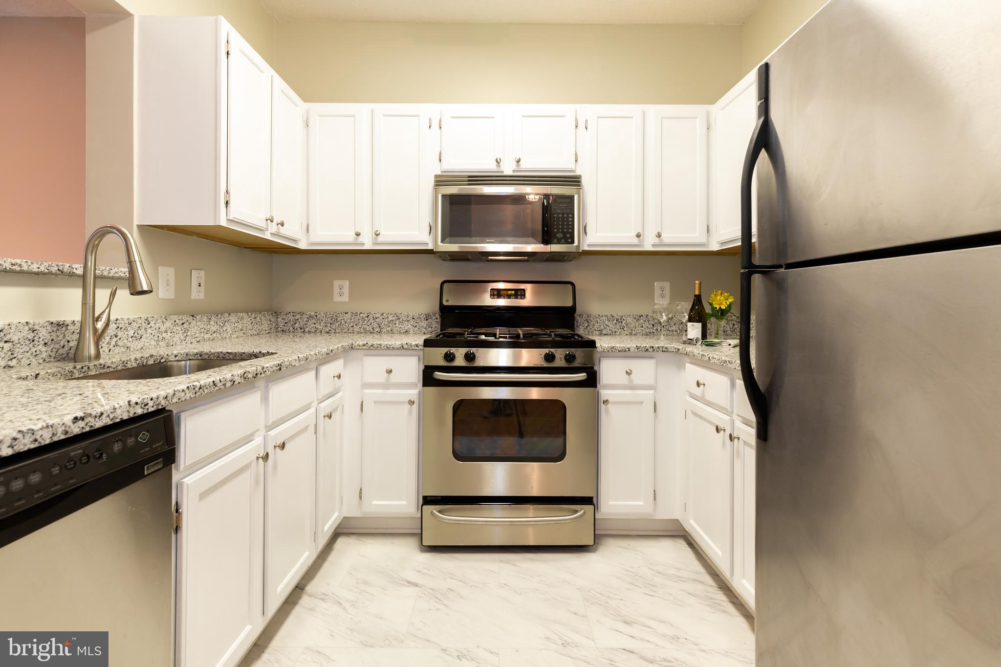 12012 Taliesin Place, Unit 14 Reston, VA 20190 - Photo 2 of 30 WHITE KITCHEN,STAINLESS, GRANITE & NEW TILE FLOORS