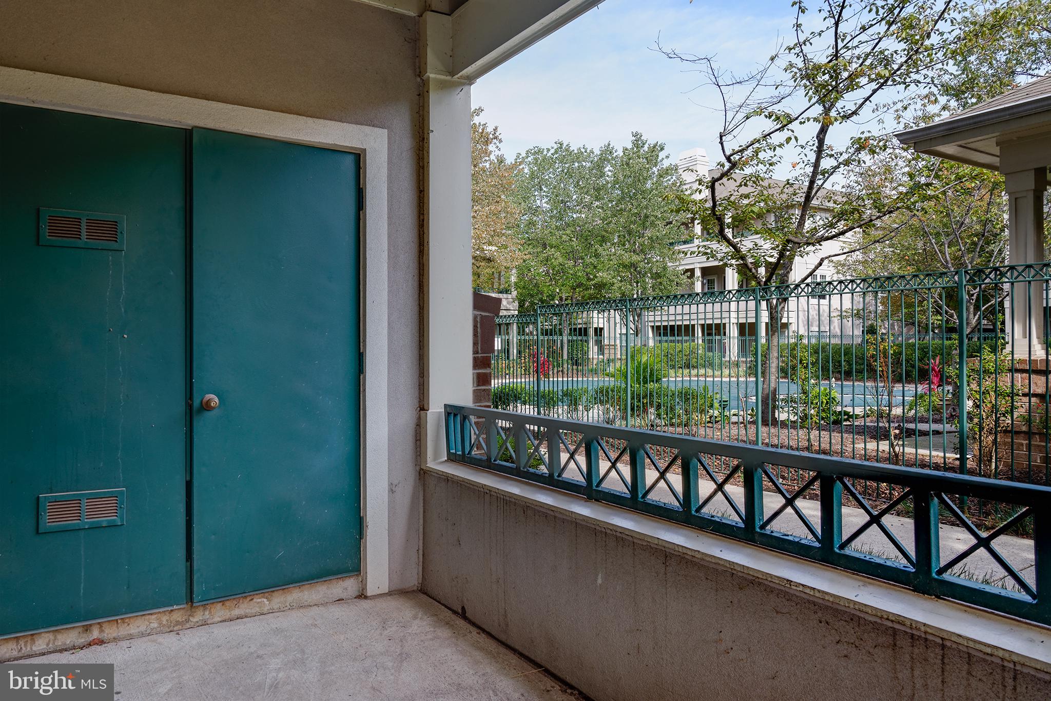 12012 Taliesin Place, Unit 14 Reston, VA 20190 - Photo 21 of 30 PATIO LOOKS OUT TO COMMUNITY POOL!