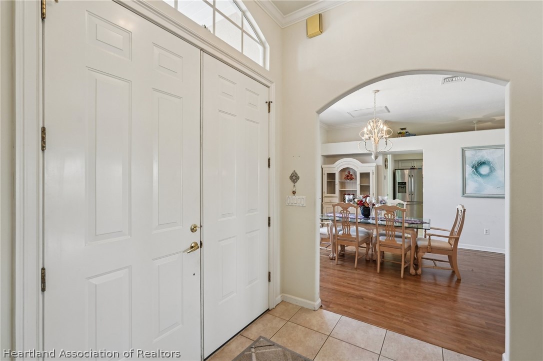 107 Orange Road Northeast Lake Placid, FL 33852 - Photo 9 of 47 Front Door - Leading to Dining Room