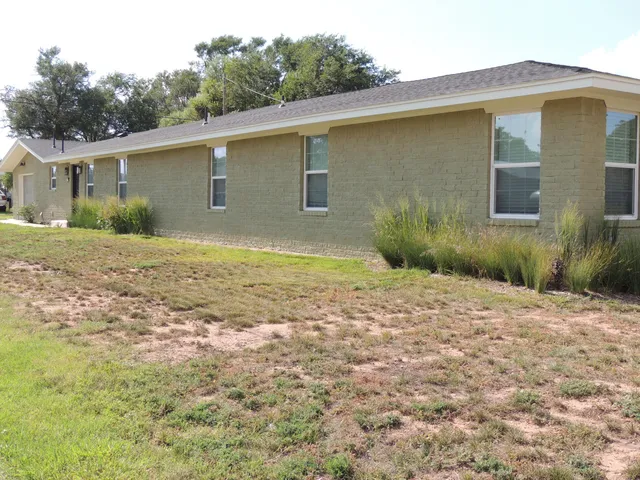 a view of a backyard of the house
