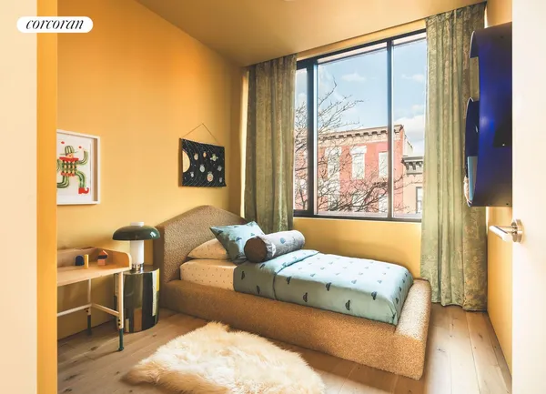 a bedroom with furniture and a window