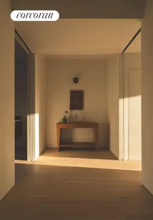 a living room with a bed and a window