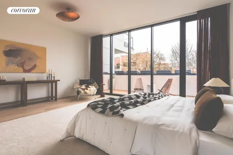 a bedroom with a bed and a large window