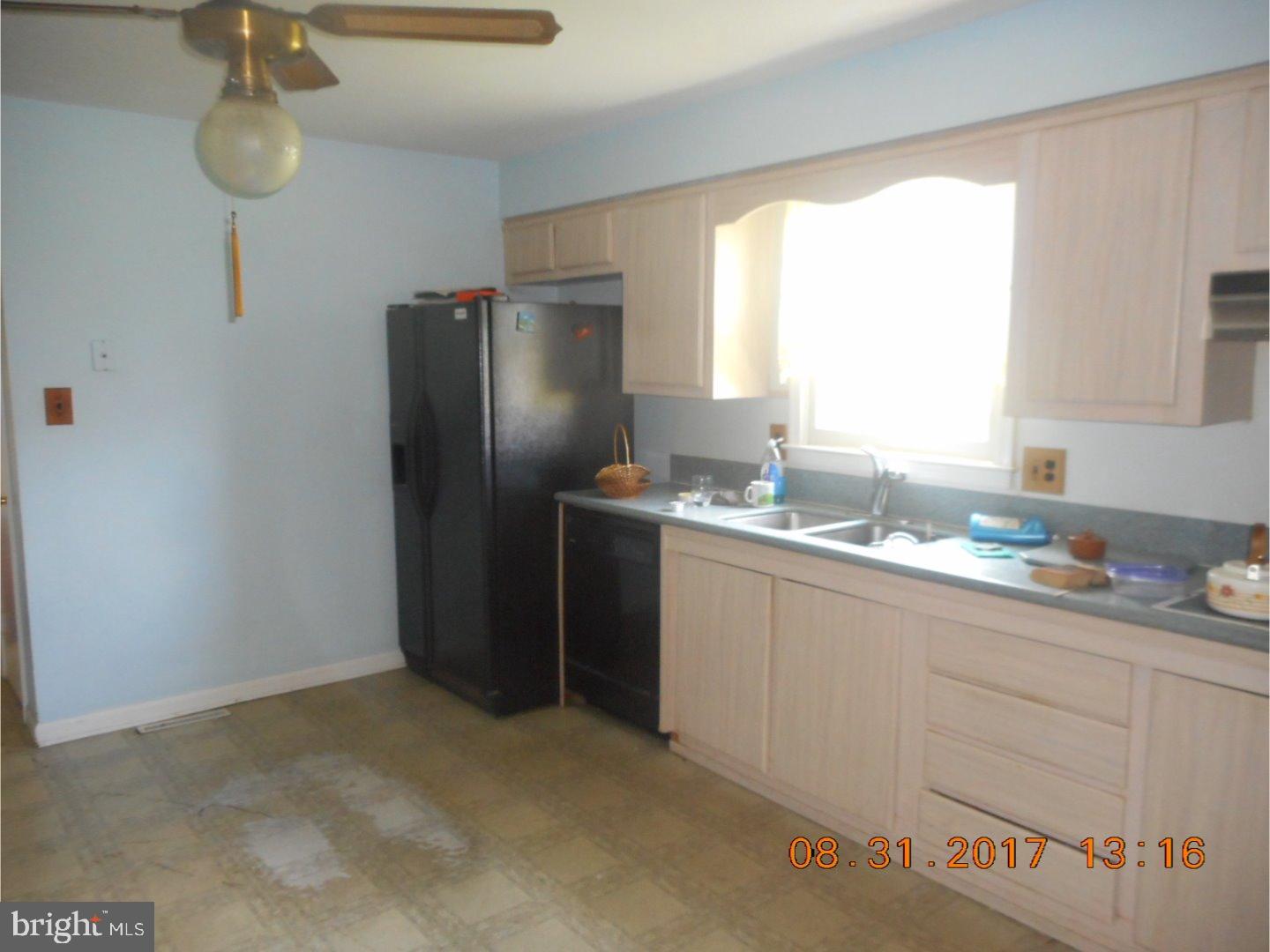6 Valley Forge Road New Castle, DE 19720 - Photo 9 of 13 a kitchen with stainless steel appliances granite countertop a refrigerator and a sink