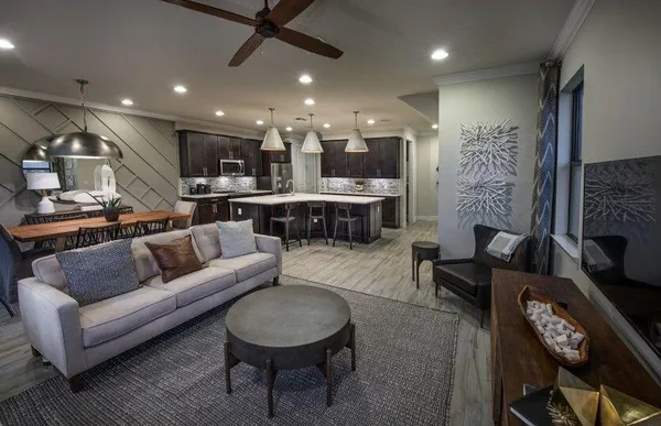 a living room with furniture and a fireplace