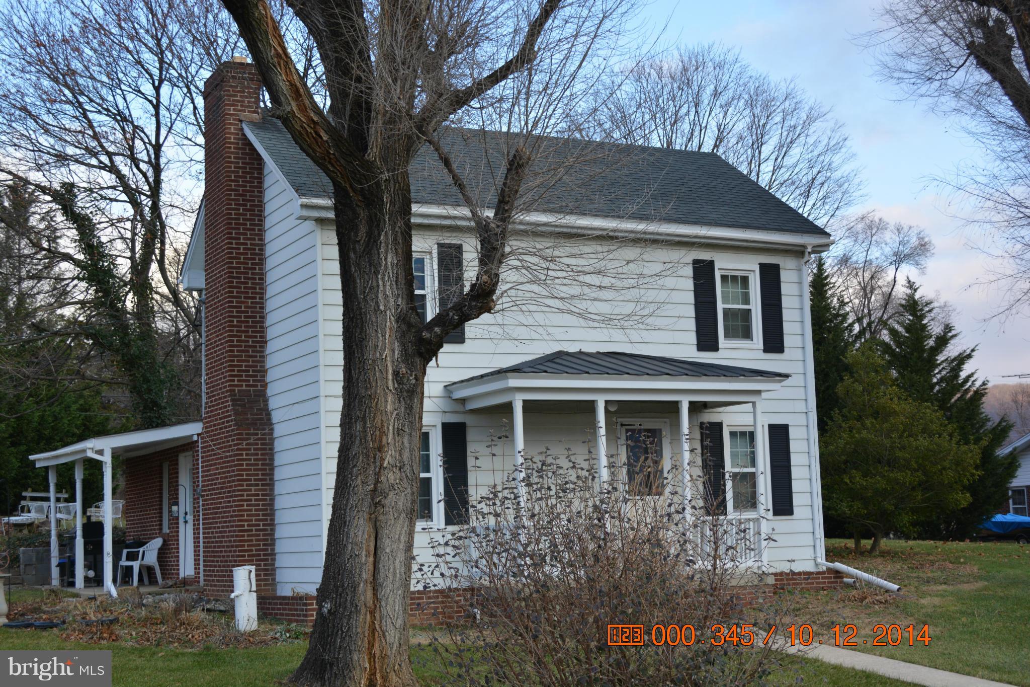 13106 Mercersburg Road Clear Spring, MD 21722 - Photo 1 of 11 a front view of a house with garden