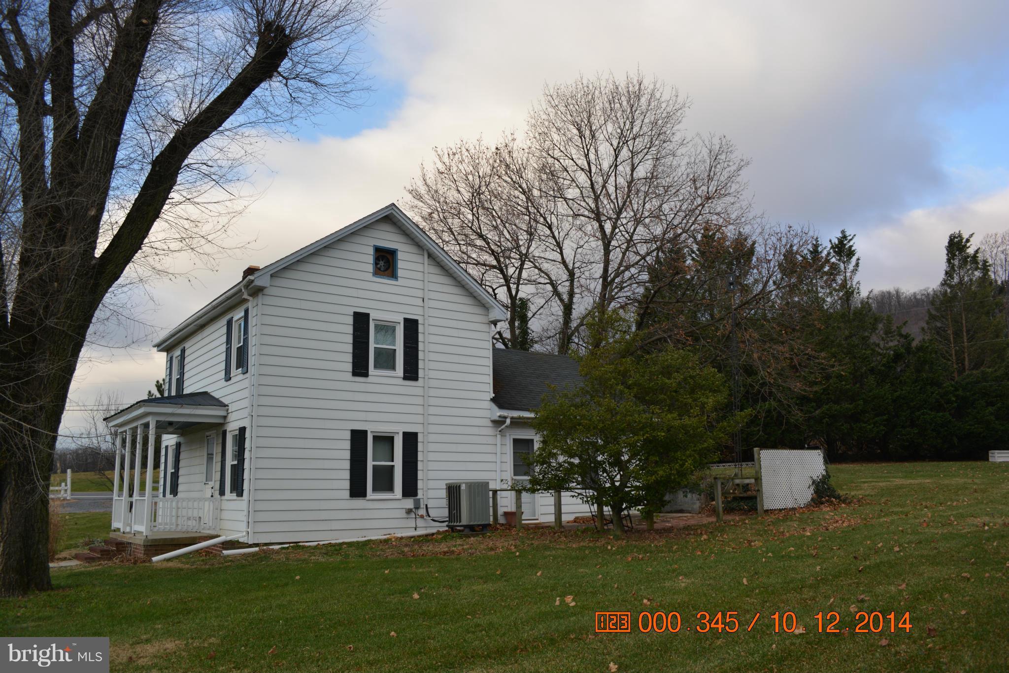13106 Mercersburg Road Clear Spring, MD 21722 - Photo 4 of 11 a front view of a house with a yard