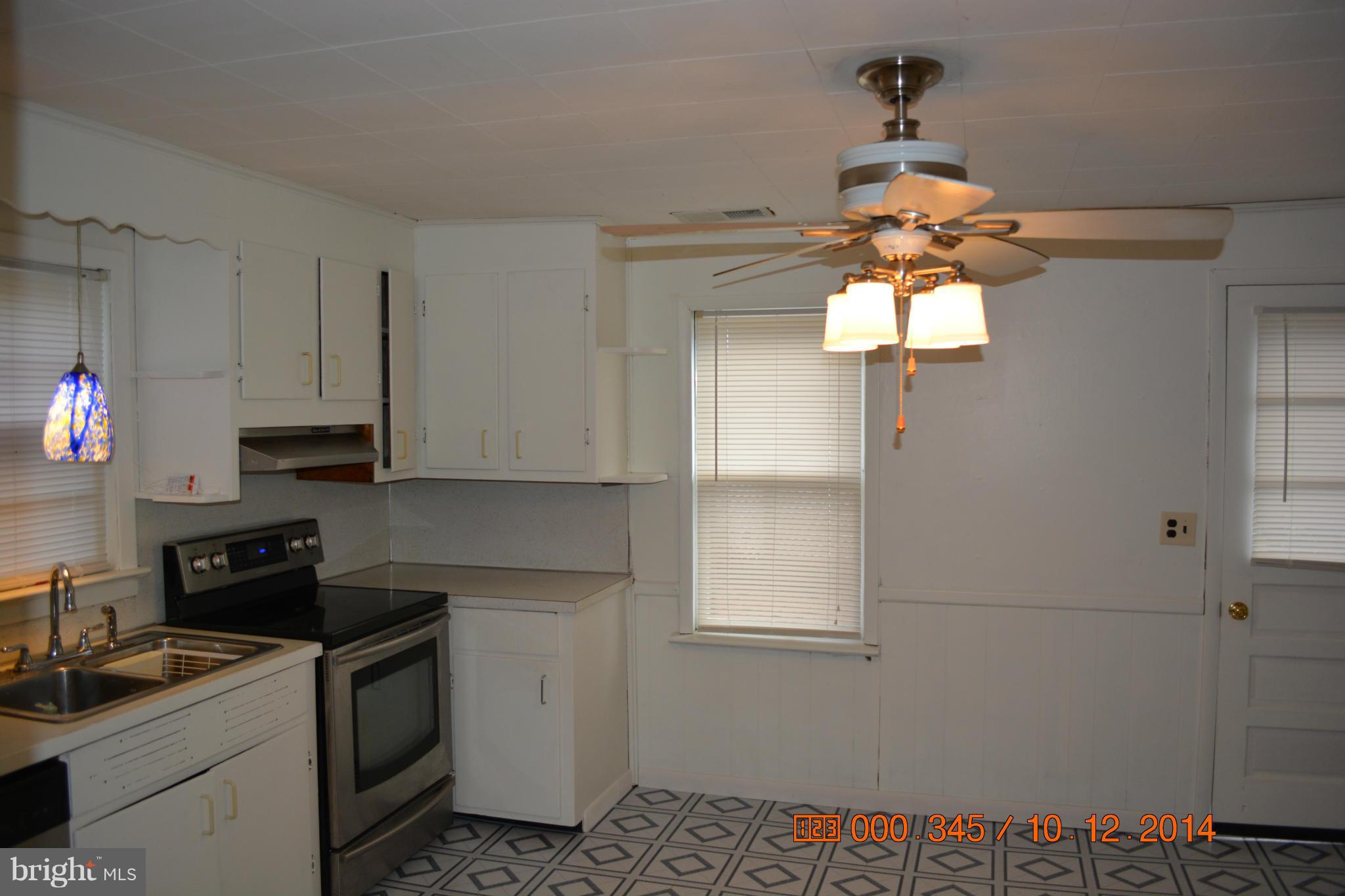 13106 Mercersburg Road Clear Spring, MD 21722 - Photo 6 of 11 a kitchen with a sink cabinets and window