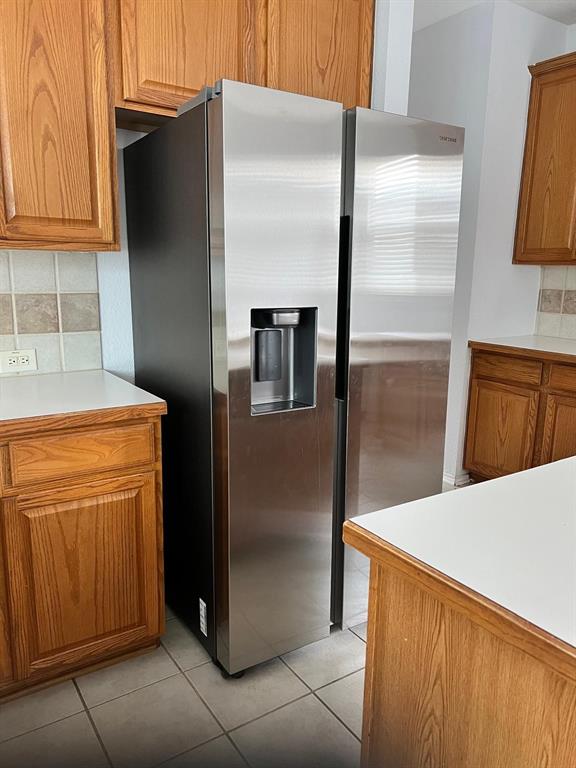 4312 Ridge Point Lane Plano, TX 75024 - Photo 17 of 18 Stainless steel side-by-side refrigerator with an external ice and water dispenser