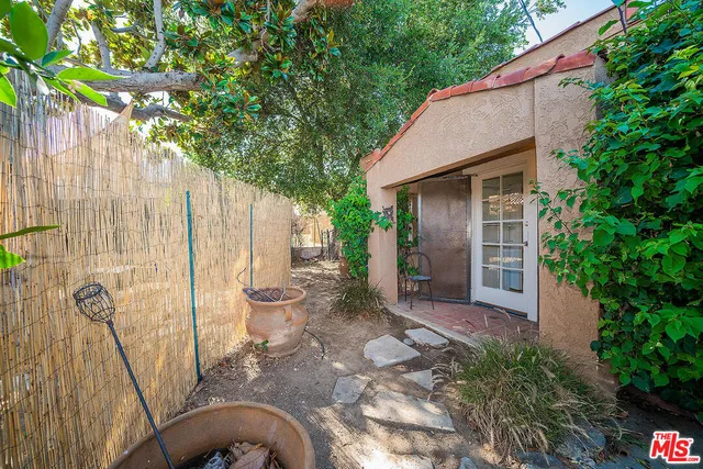 a backyard of a house with seating space