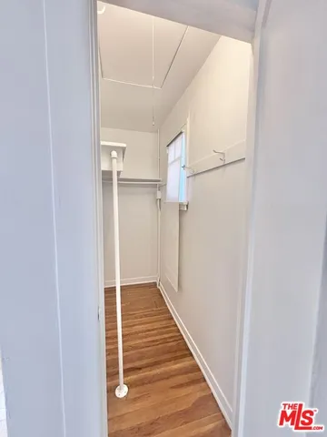 a view of hallway with wooden floor