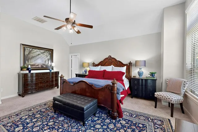 a bedroom with furniture and a couch