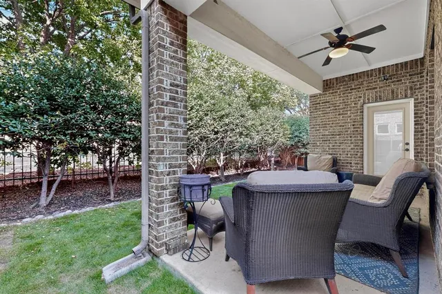 a view of a patio with a table and chairs