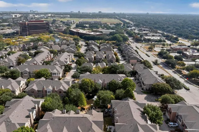 an aerial view of a city with lots of residential buildings