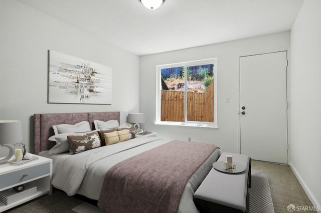 a bedroom with bed and window