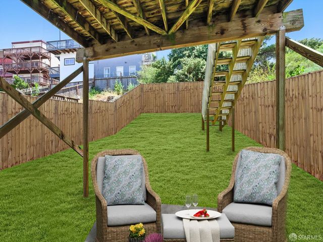 a outdoor living space with furniture and garden view