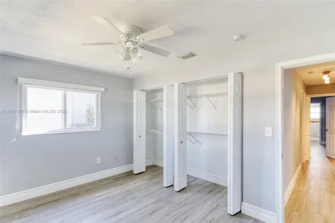 a bathroom with a sink vanity mirror and toilet