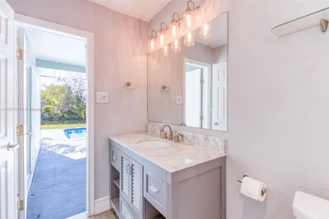 a view of a bathroom with a window and a sink