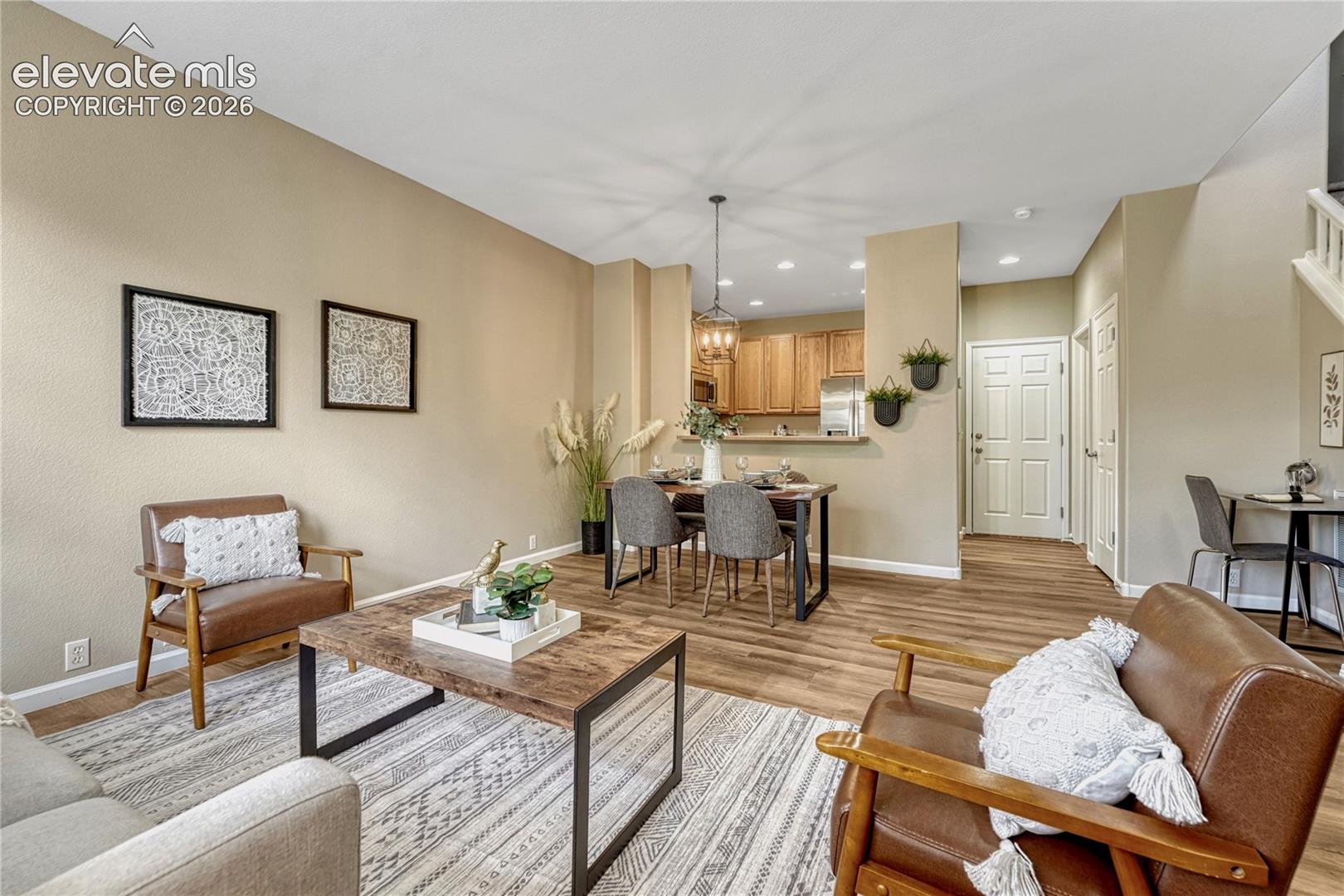 4147 Diamond Ridge View Colorado Springs, CO 80918 - Photo 40 of 42 Enjoy a seamless open floor plan where the living room, dining nook, and kitchen effortlessly blend to maximize space and connection