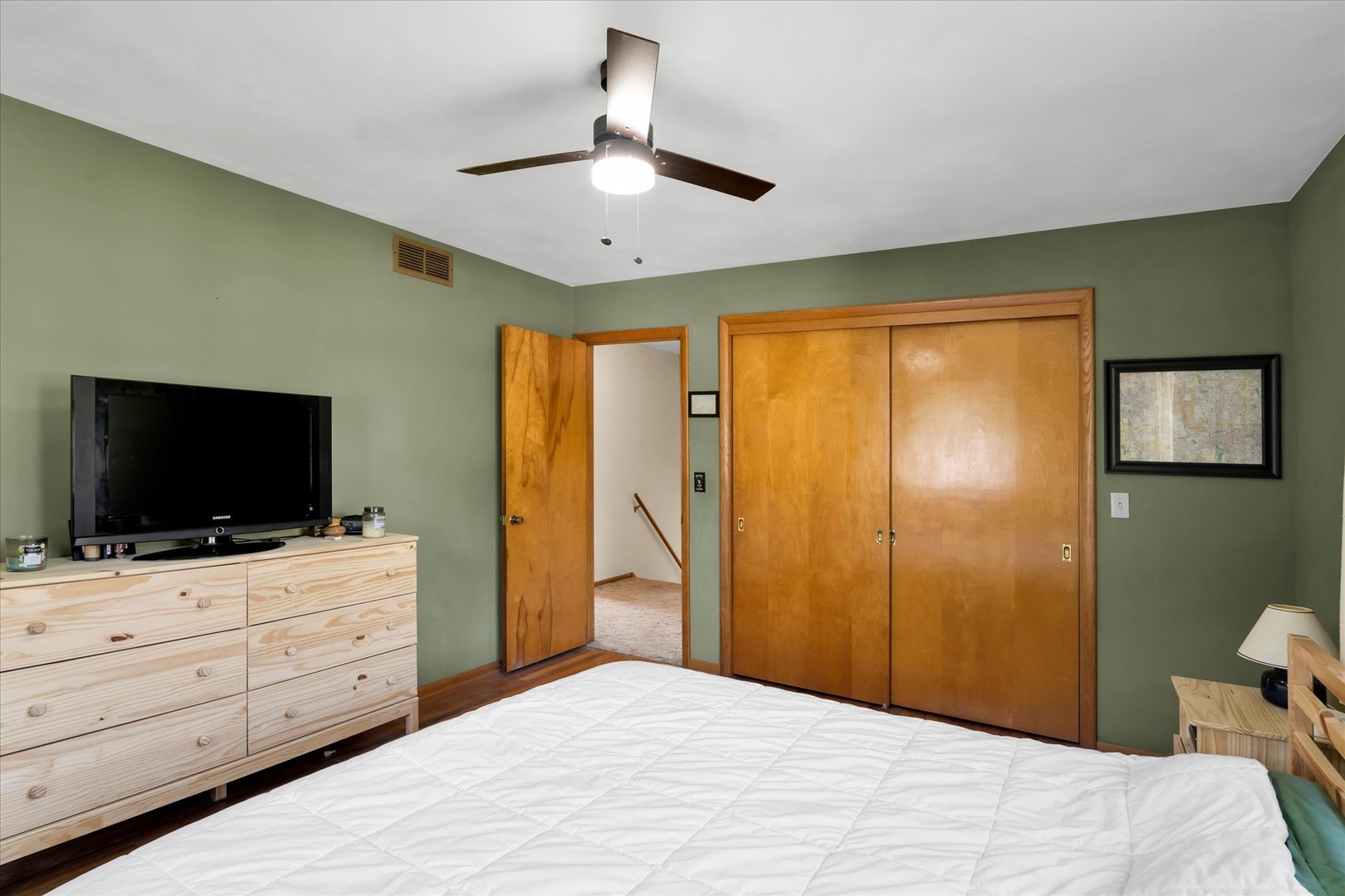 1110 Silver Street Urbana, IL 61801 - Photo 20 of 40 a bedroom with a bed and a flat screen tv