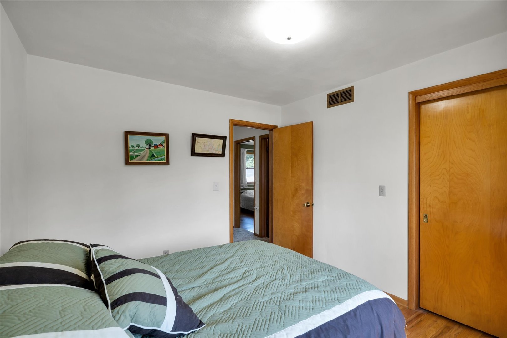 1110 Silver Street Urbana, IL 61801 - Photo 22 of 40 a bedroom with a bed and ceiling fan