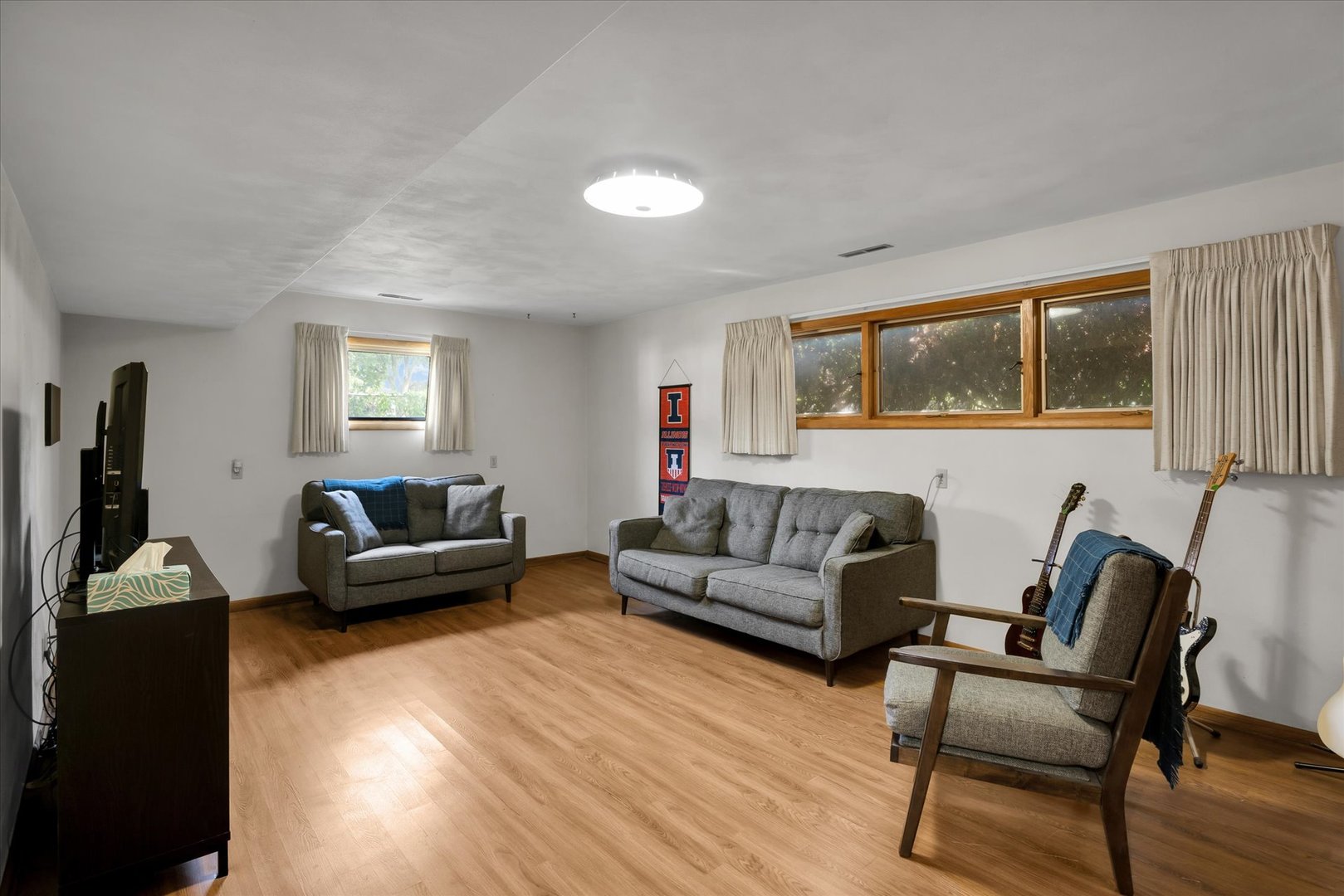 1110 Silver Street Urbana, IL 61801 - Photo 23 of 40 a living room with furniture and a flat screen tv