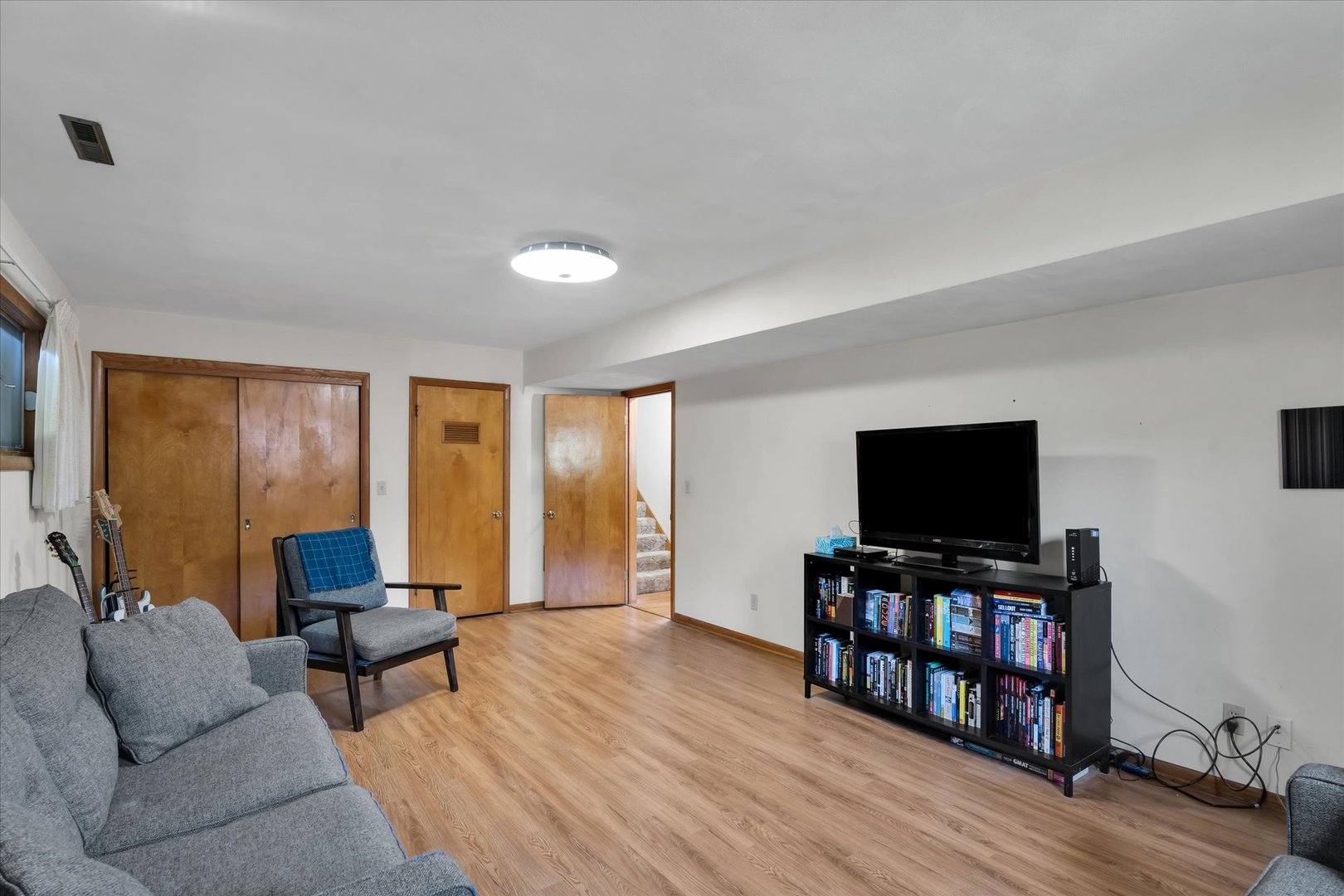 1110 Silver Street Urbana, IL 61801 - Photo 24 of 40 a living room with furniture and a flat screen tv