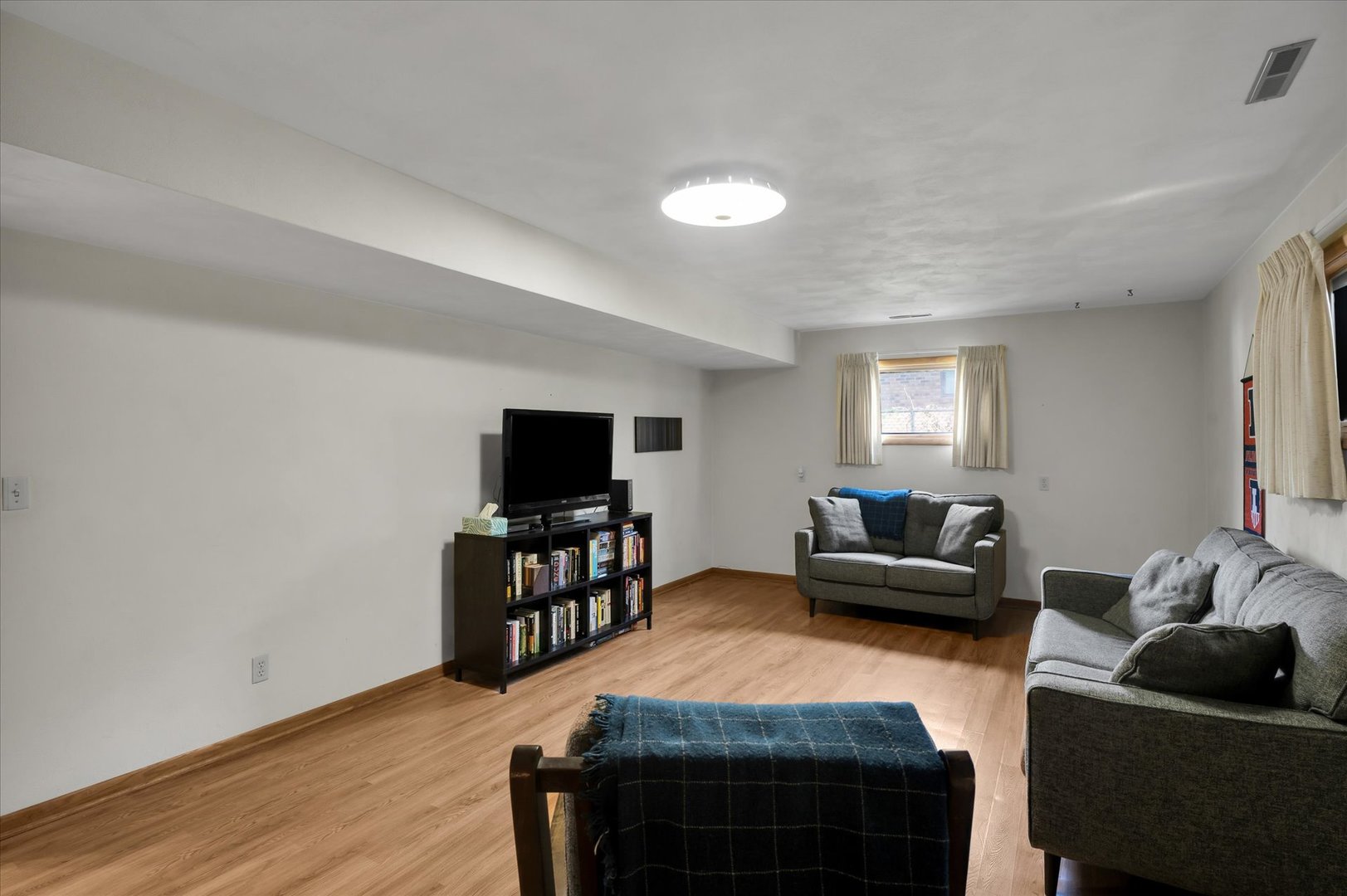1110 Silver Street Urbana, IL 61801 - Photo 25 of 40 a living room with furniture and a flat screen tv