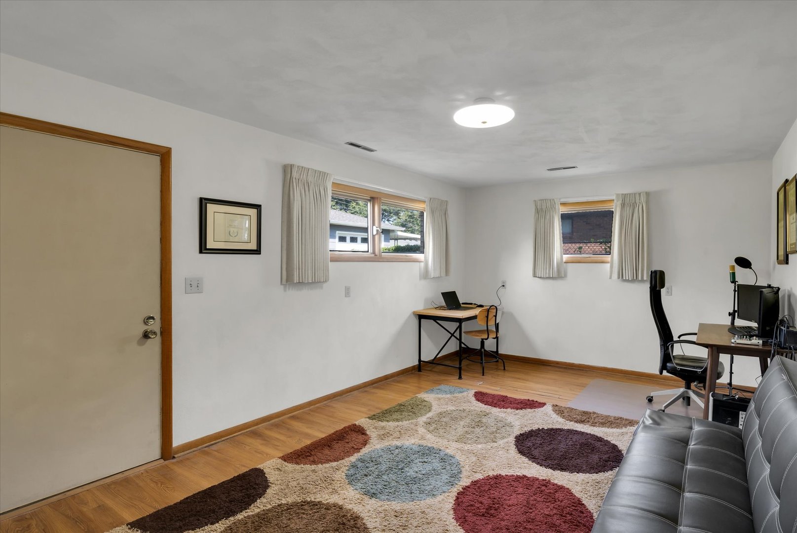 1110 Silver Street Urbana, IL 61801 - Photo 26 of 40 a bedroom with a bed and wooden floor