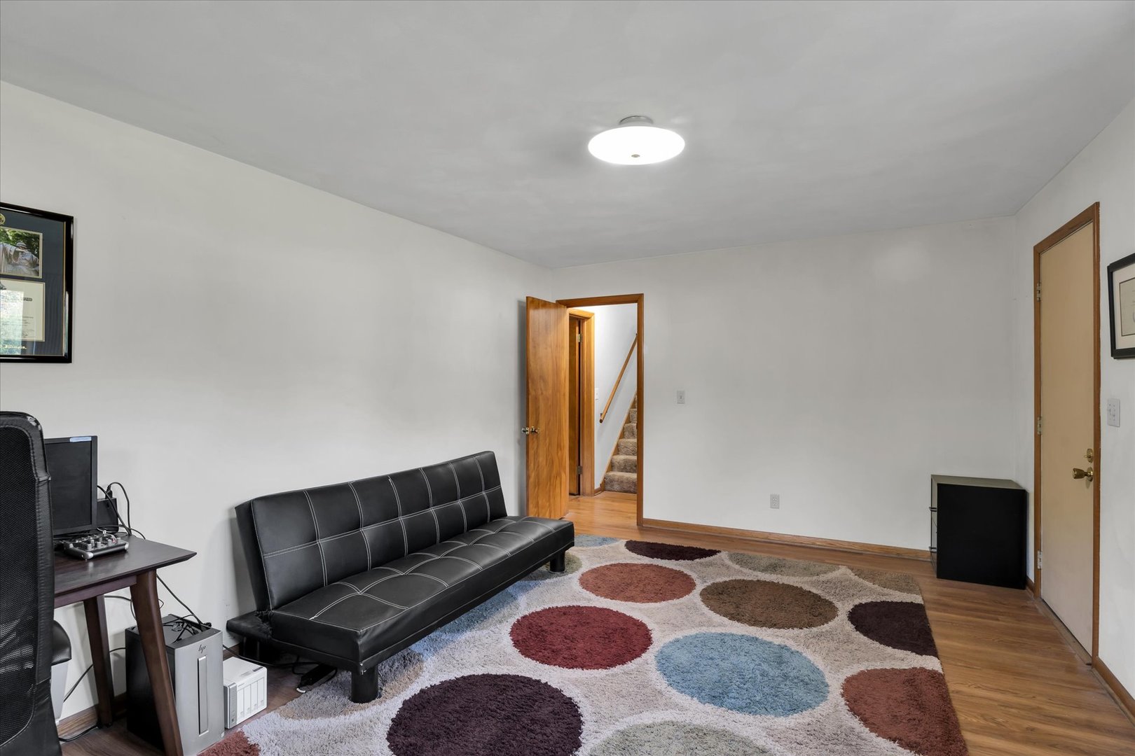 1110 Silver Street Urbana, IL 61801 - Photo 27 of 40 a living room with a couch and a rug