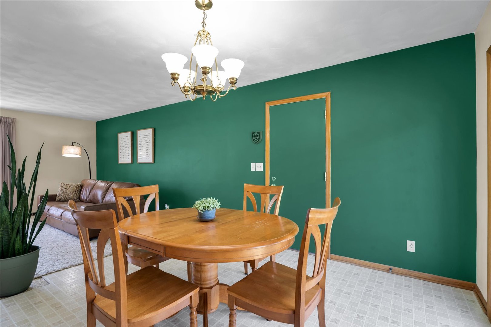 1110 Silver Street Urbana, IL 61801 - Photo 9 of 40 a view of a dining room with furniture and a chandelier fan