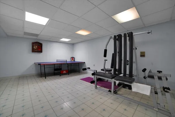 a room with furniture and air hockey table