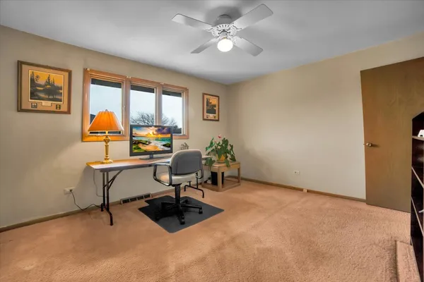 a workspace with furniture and window