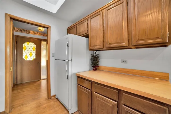 a view of walk in closet with wooden floor