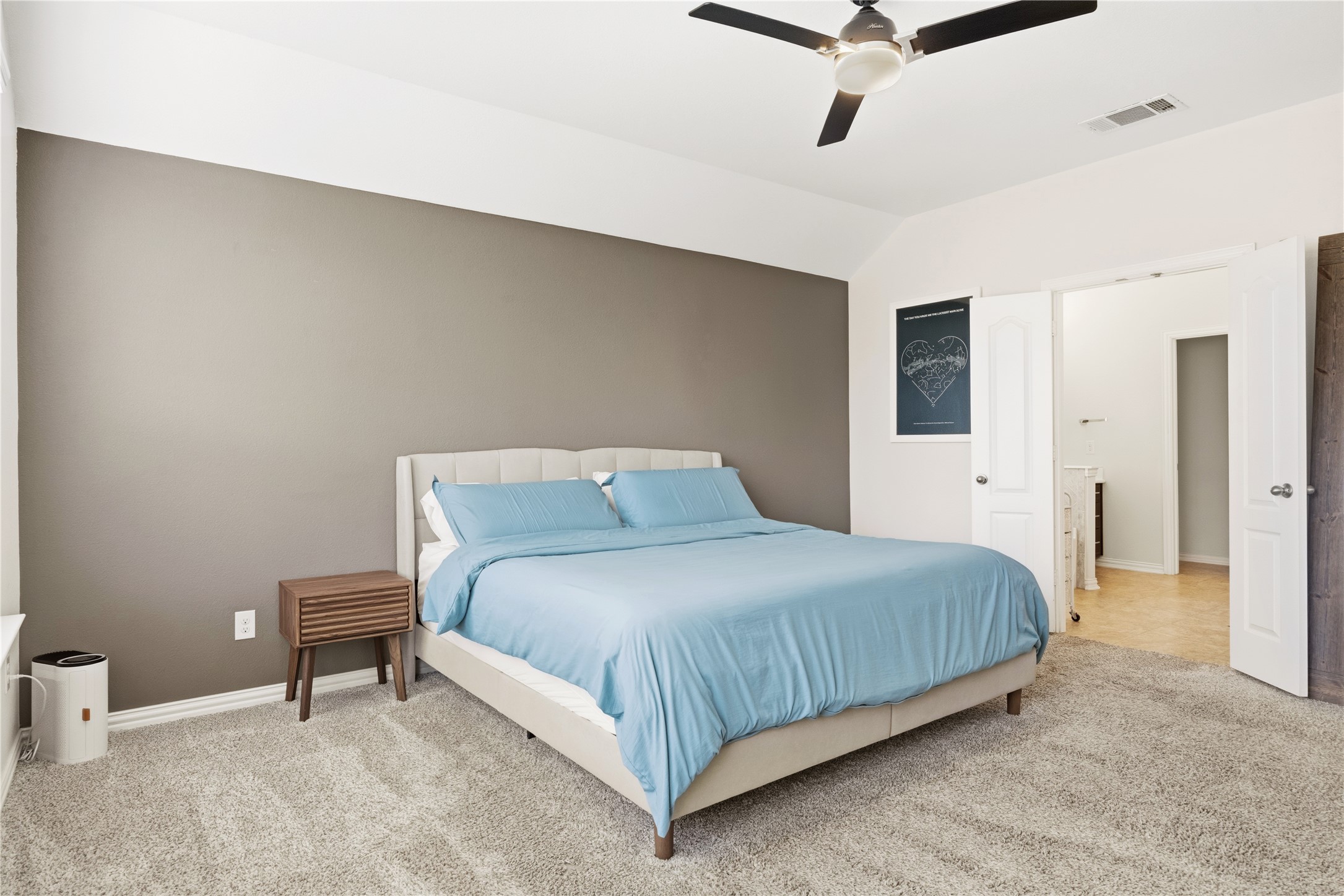 486 Pond View Pass Buda, TX 78610 - Photo 29 of 39 Carpeted room featuring a ceiling fan with light fixture, vaulted ceiling, and dual interior doors