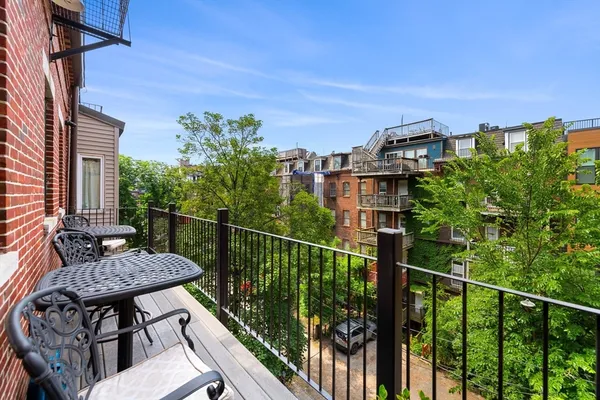 a view of a balcony with chairs