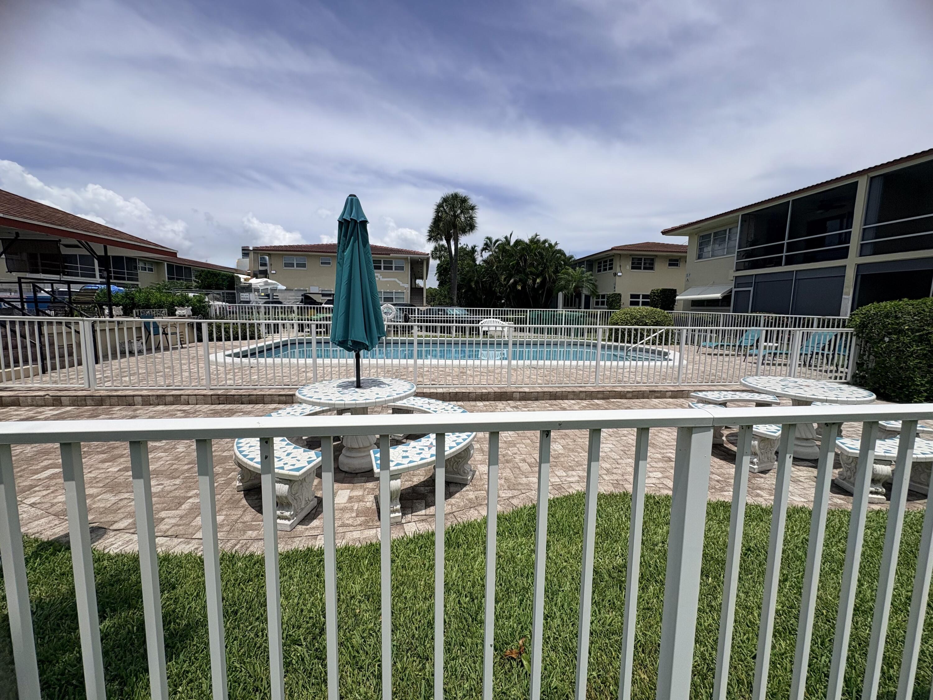 2202 Northeast 36th Street, Unit 17 Lighthouse Point, FL 33064 - Photo 1 of 28 Courtyard, pool common area