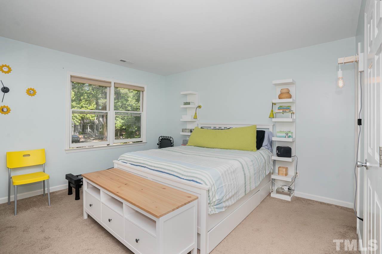 406 Old Fox Trail Durham, NC 27713 - Photo 13 of 23 a bedroom with a bed and a window