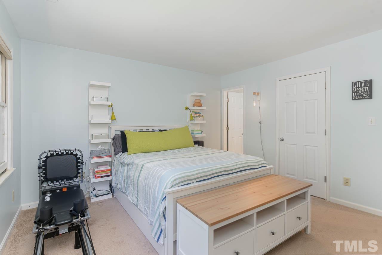 406 Old Fox Trail Durham, NC 27713 - Photo 14 of 23 a bedroom with a bed and a chair