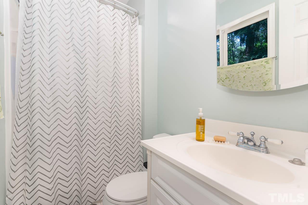 406 Old Fox Trail Durham, NC 27713 - Photo 15 of 23 a bathroom with a sink and a mirror