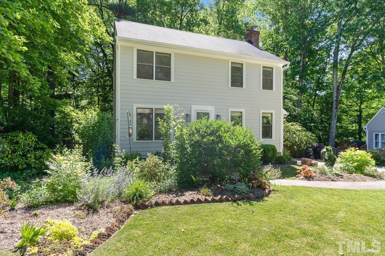 406 Old Fox Trail Durham, NC 27713 - Photo 2 of 23 a front view of a house with a yard