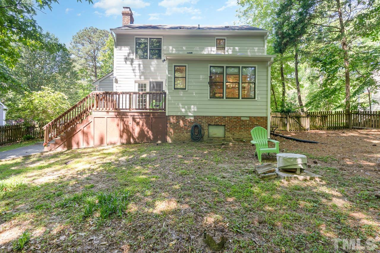 406 Old Fox Trail Durham, NC 27713 - Photo 21 of 23 a view of a chair and table in backyard of the house