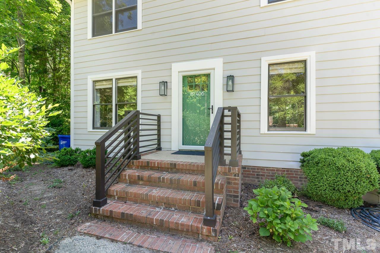 406 Old Fox Trail Durham, NC 27713 - Photo 3 of 23 a front view of a house with garden