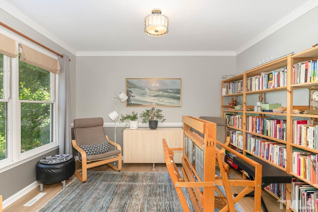 406 Old Fox Trail Durham, NC 27713 - Photo 5 of 23 a living room with furniture and a book shelf