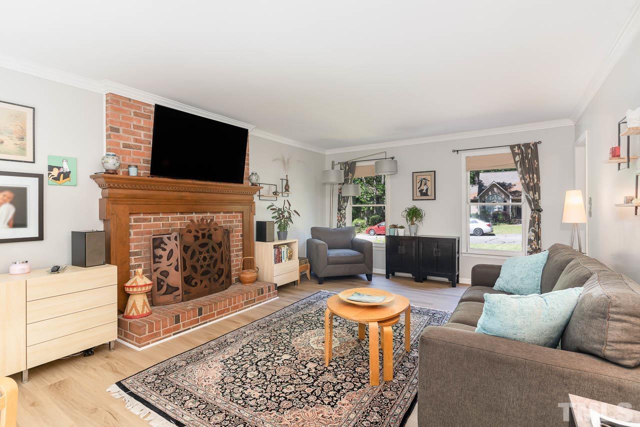 406 Old Fox Trail Durham, NC 27713 - Photo 7 of 23 a living room with furniture flat screen tv and a fireplace